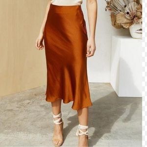 Beautiful burnt orange midi skirt with slit on left side